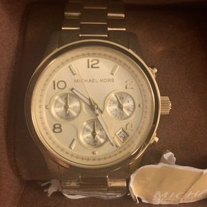 Michale Kors gold watch.